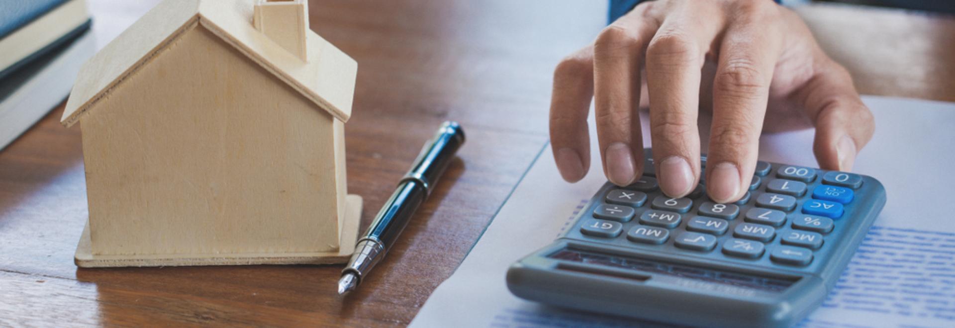 hand using calculator for tax credits